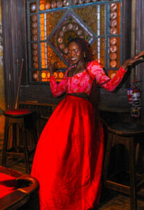 Oyinkan Wearing Red Full Skirt Pink Floral Top at the Creator Logic Holiday Party- Befitting Style-30